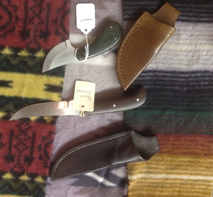 The brown knife is made from Desert Ironwood and the green one has a composite handle.