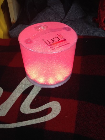 A Luci Lantern that is on.